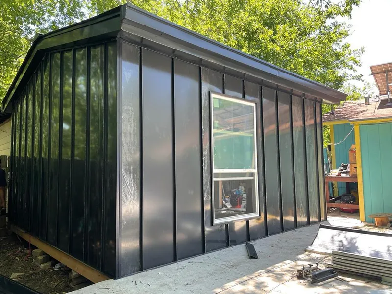 Black standing seam metal wall panels for Roof Inspection in Terrell Hills