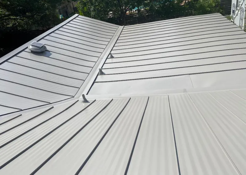 Solar attic fan installed on a metal roof for Roof Ventilation in Terrell Hills